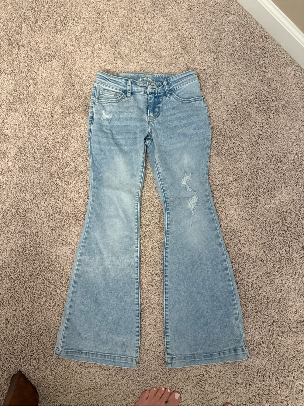 Girls size 8 jeans . Worn once